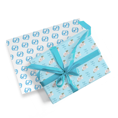 Two boxes wrapped in beautiful custom branded gift wrapping